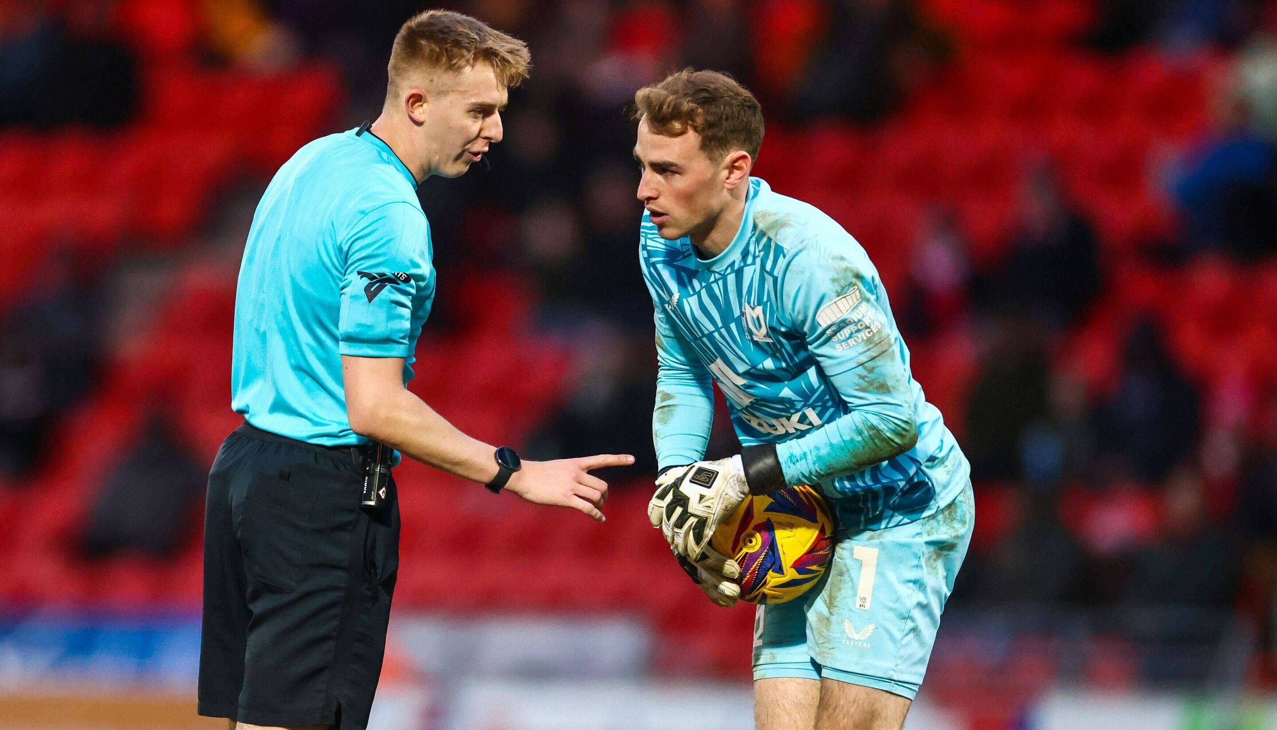 Referee with goalkeeper