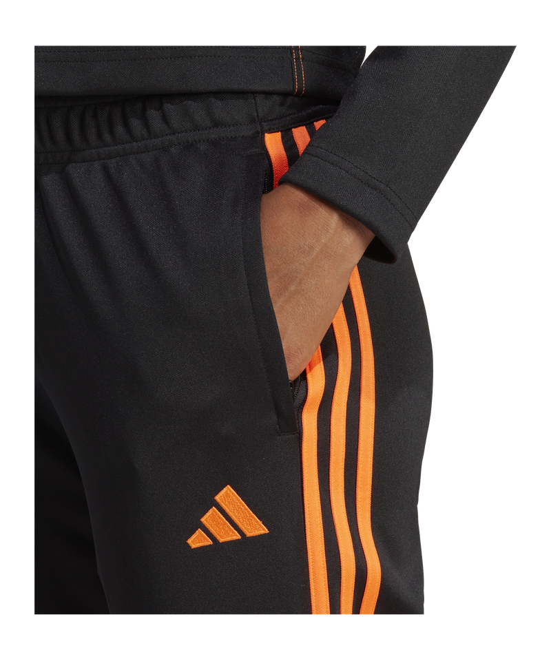 Black adidas pants hot sale with orange stripes